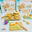 My Little Cooking Playset complete wooden kitchen toy set displayed outside its packaging, featuring a stove, frying pan, cooking pot, cutting board, toy fish, vegetables, knife and cooking accessories.